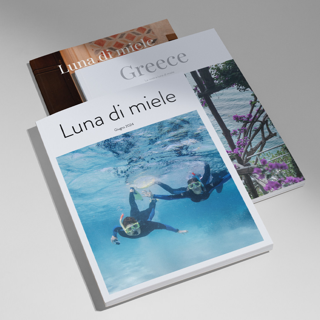 Tre riviste per la luna di miele impilate che mostrano i disegni delle copertine