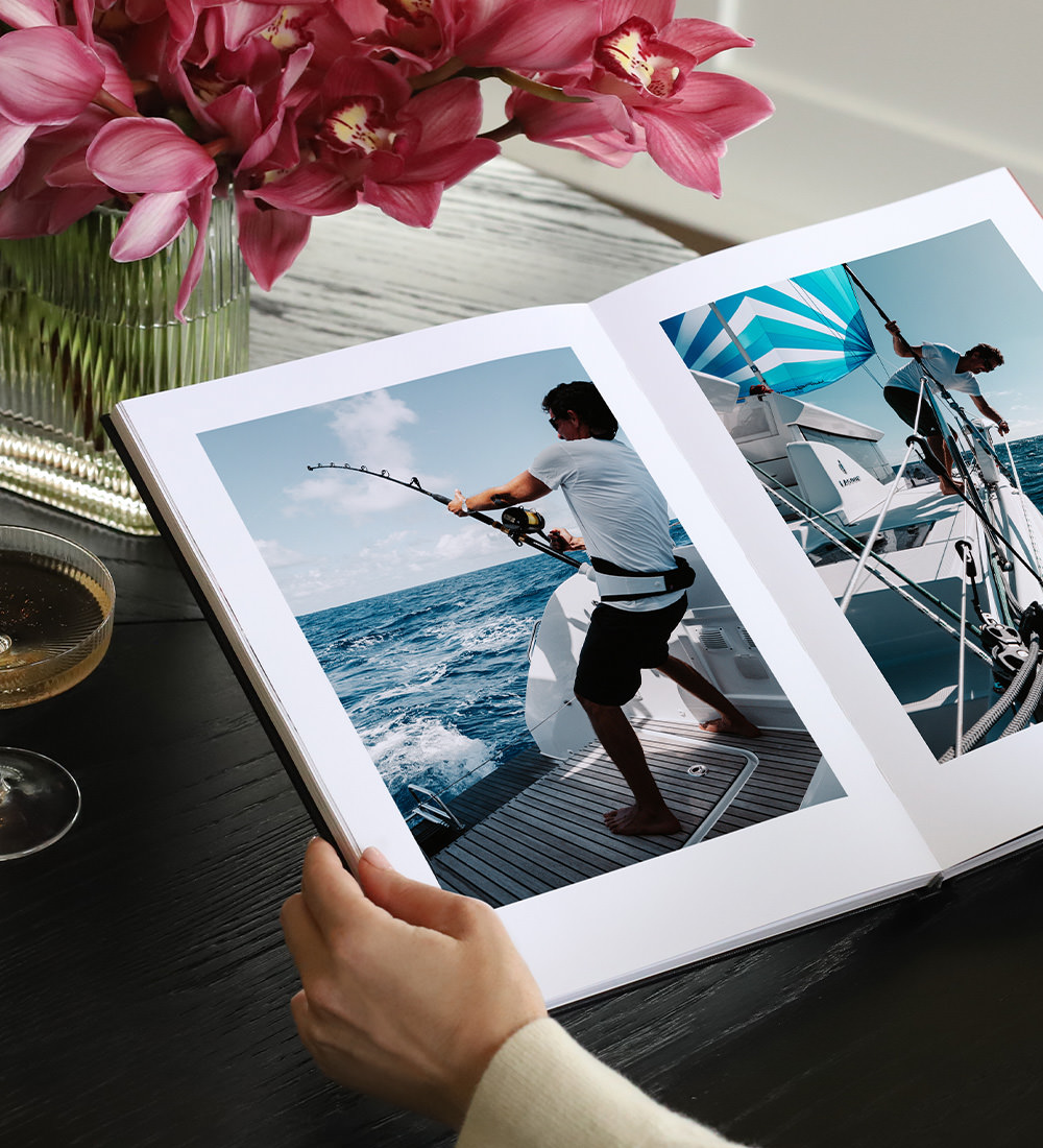 Open Portrait Photo Book of a man on a boat fishing.