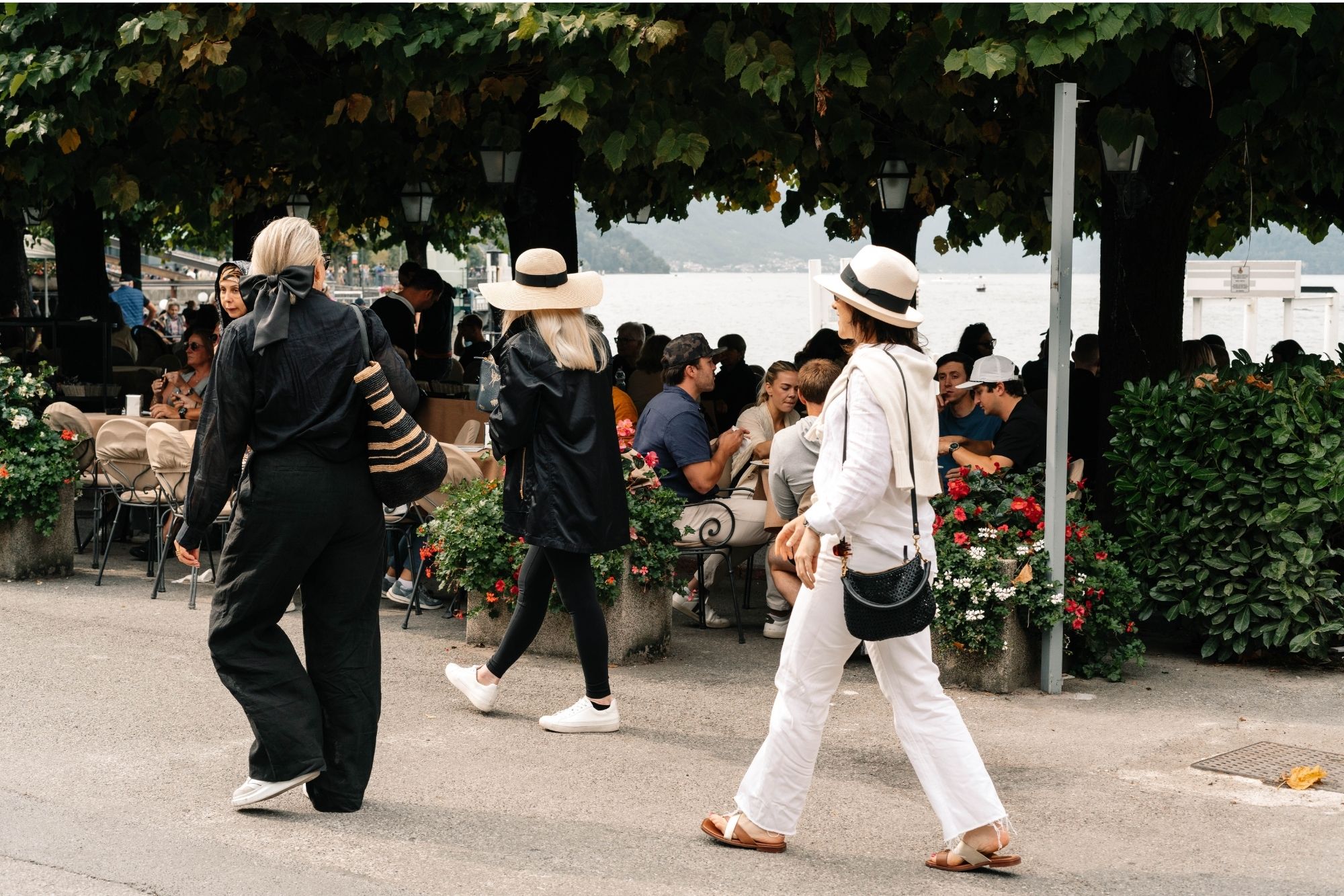 Candid photo of friends walking down a busy street