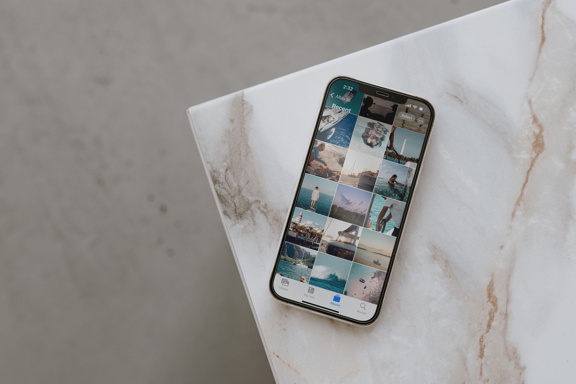 Image of iphone on table with photos open