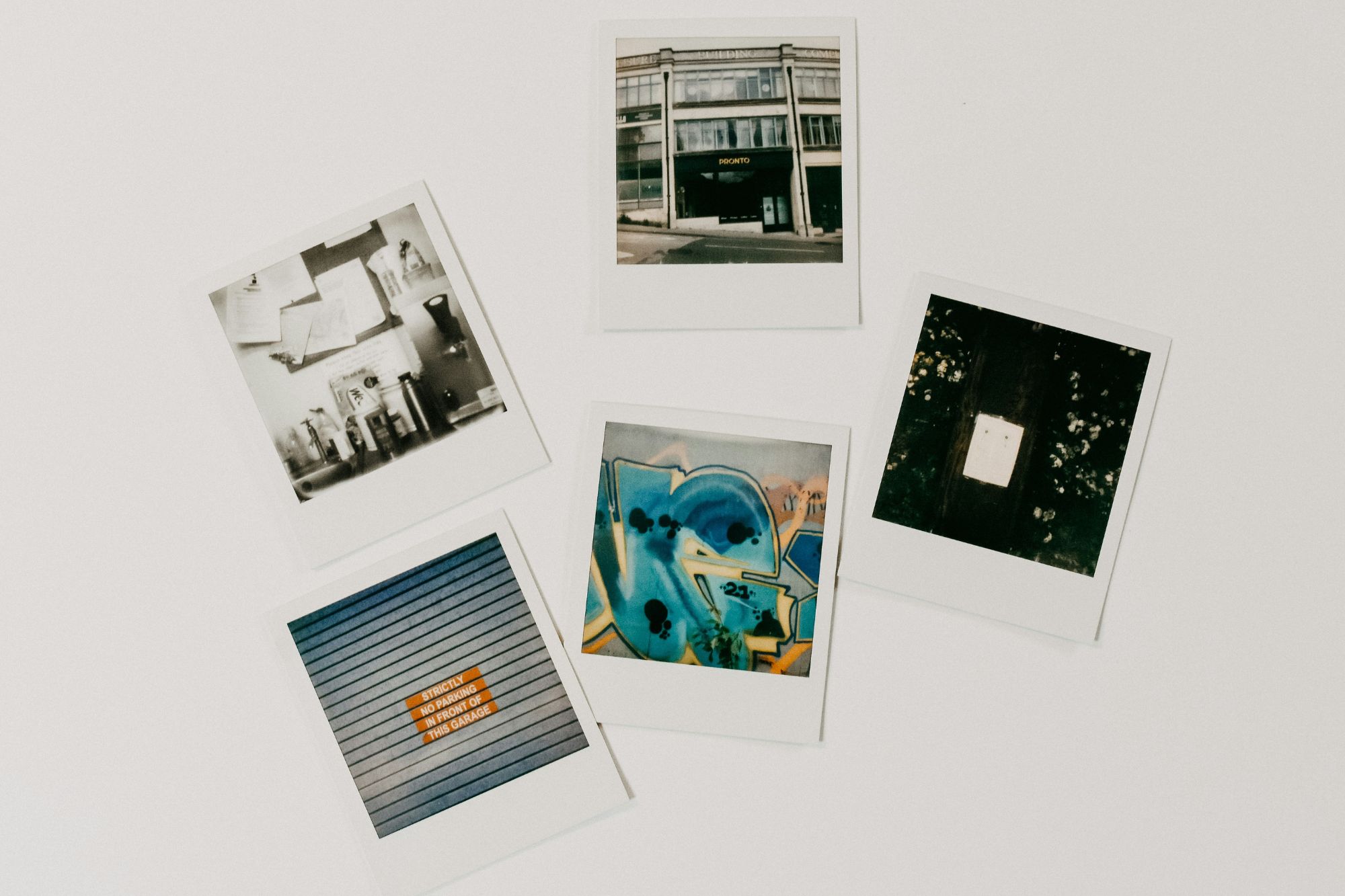 Polaroids layed out on a desk