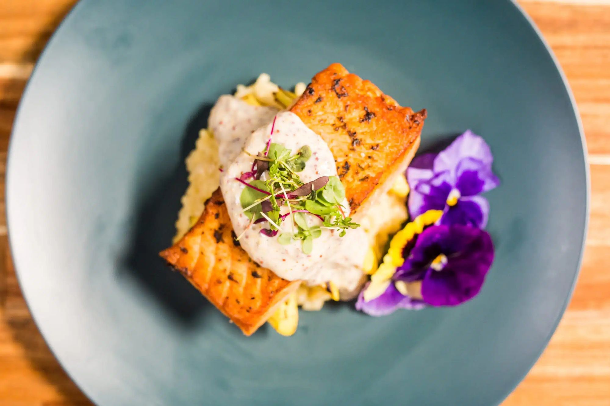 close up photo of fine dining meal with edible flowers