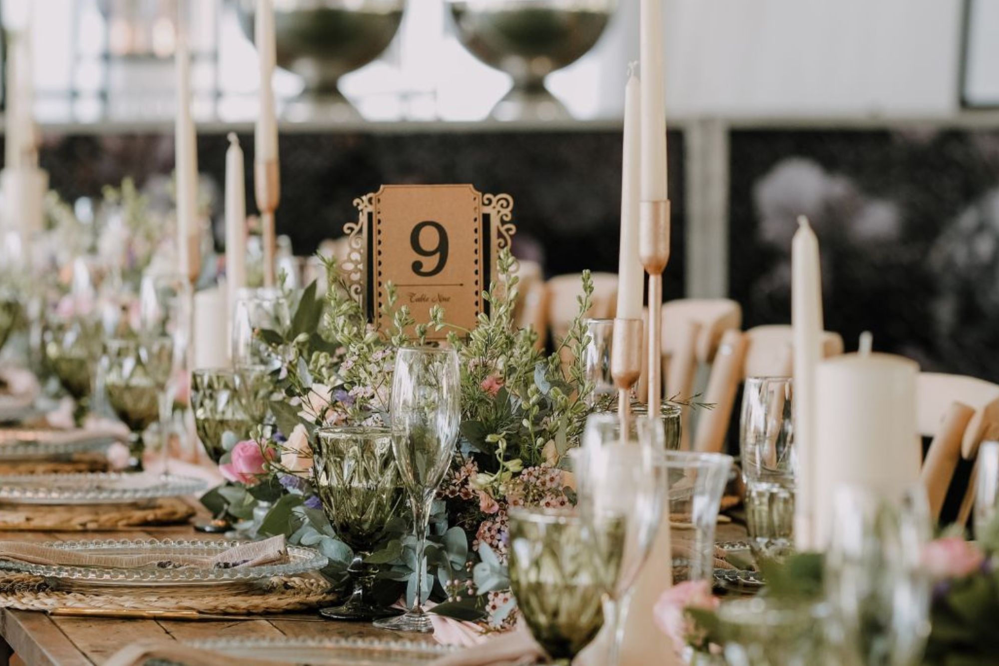 close up of rustic wedding table decorations with flowers and candles