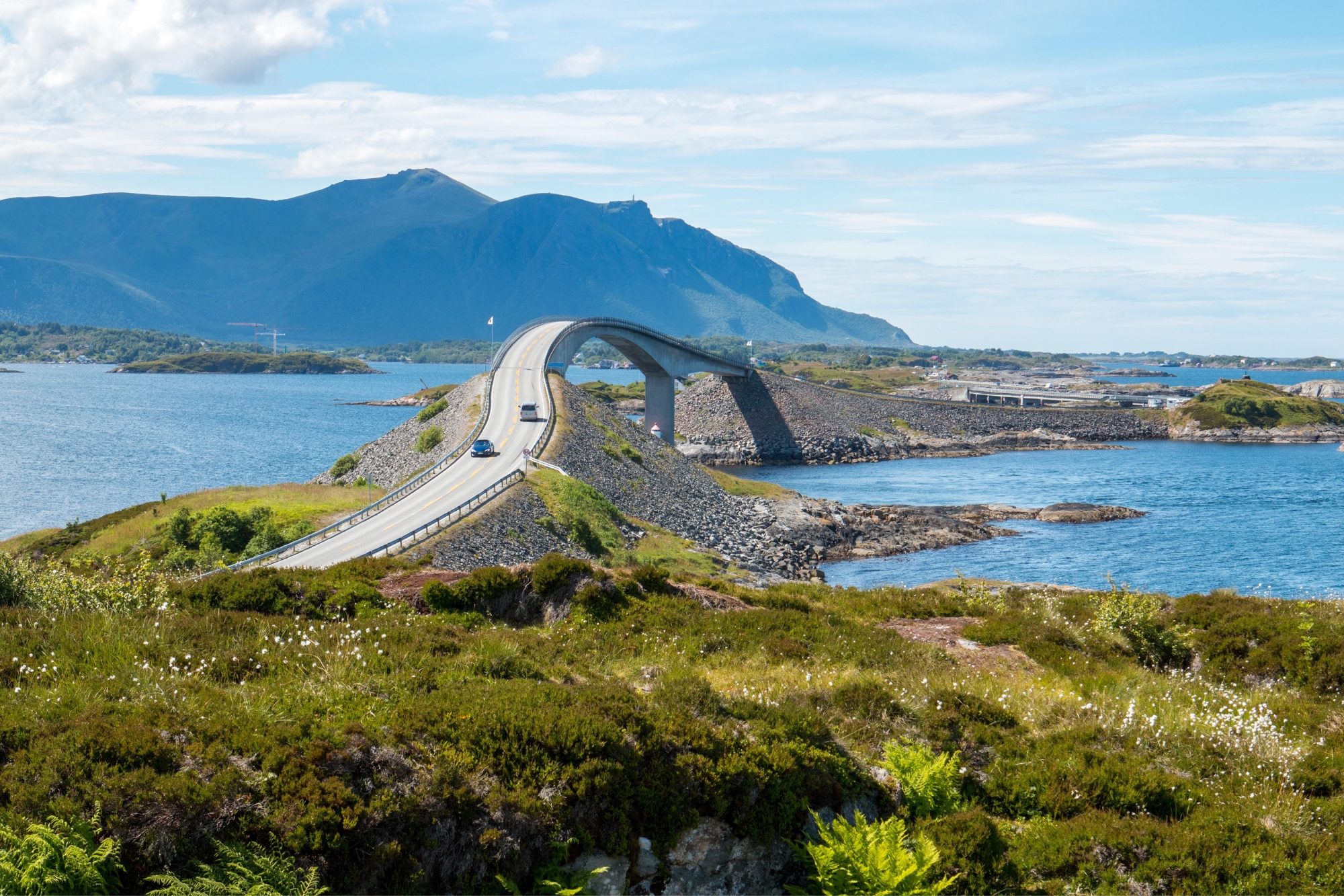 Arched bridge over chain of islands in Norway.