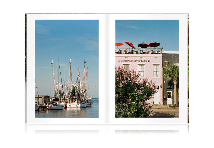 Large Travel Magazine with photos of Charleston on double-page spread.