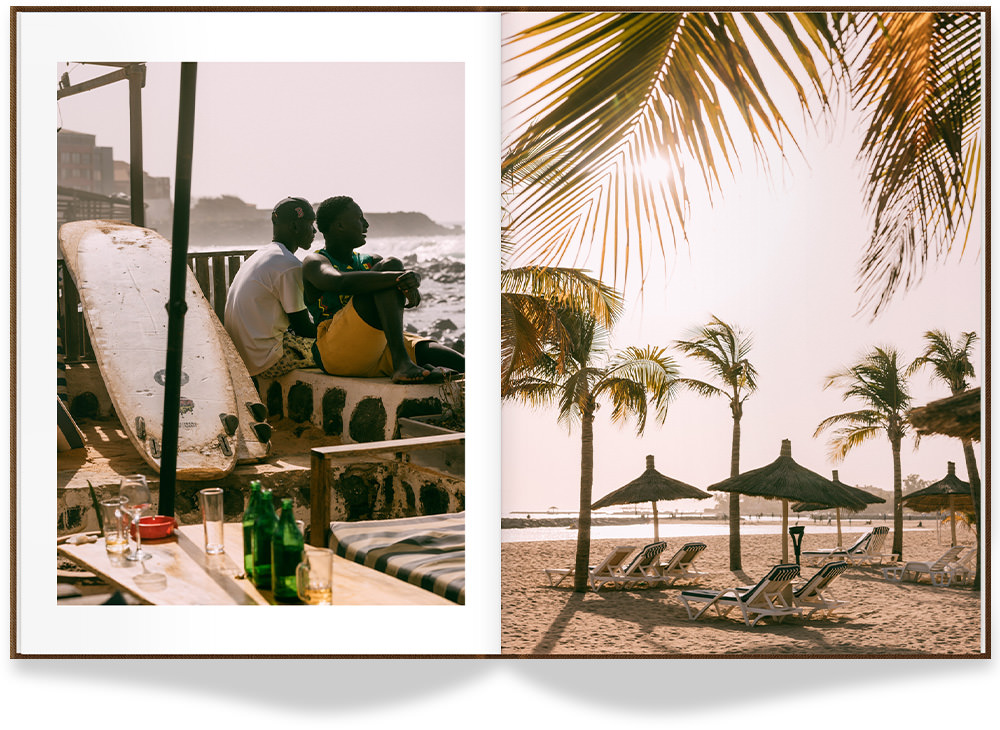 Open Portrait Photo Book with photos of beach in Senegal on double-page spread.