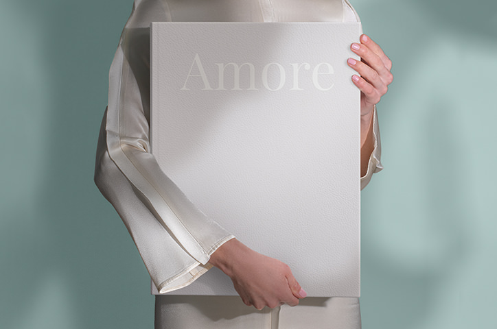 Girl holding the MILK XL Premium Album