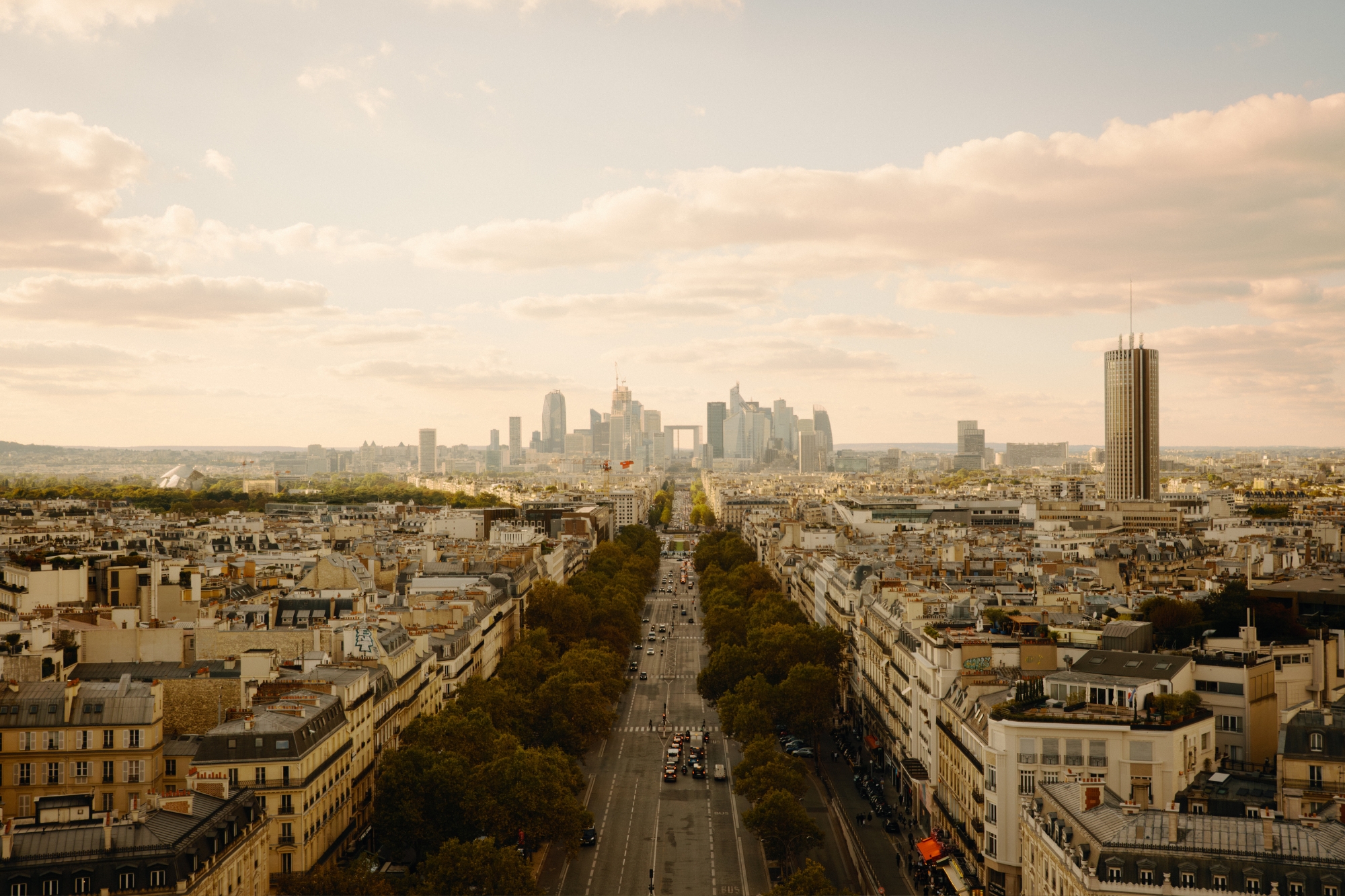photo of a European city road with skyscapers in background
