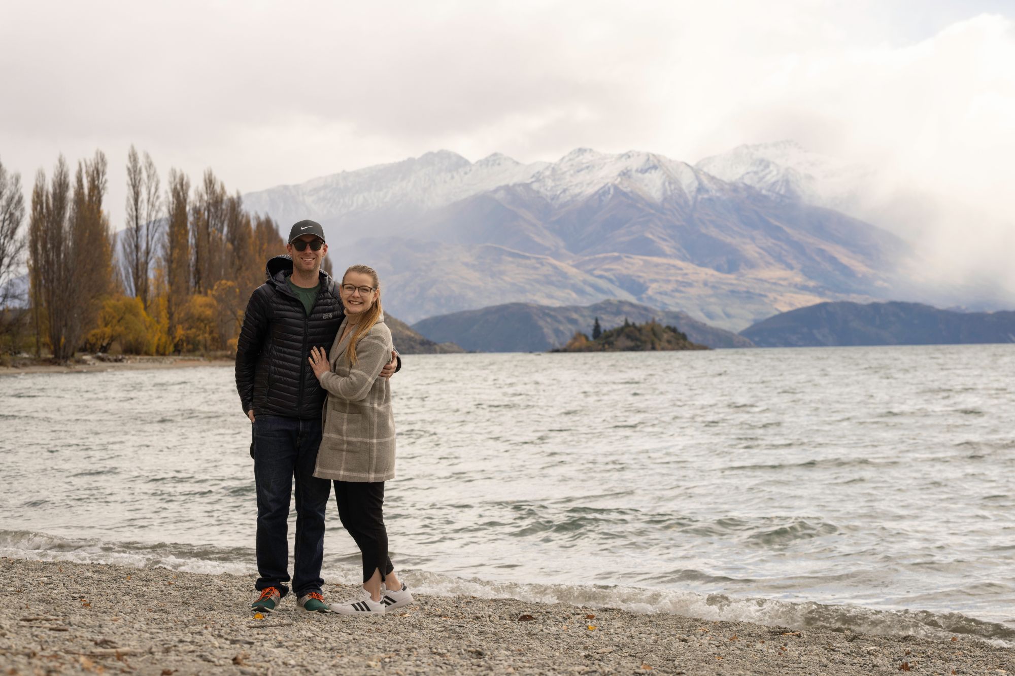 Couple posed in front of mountain
