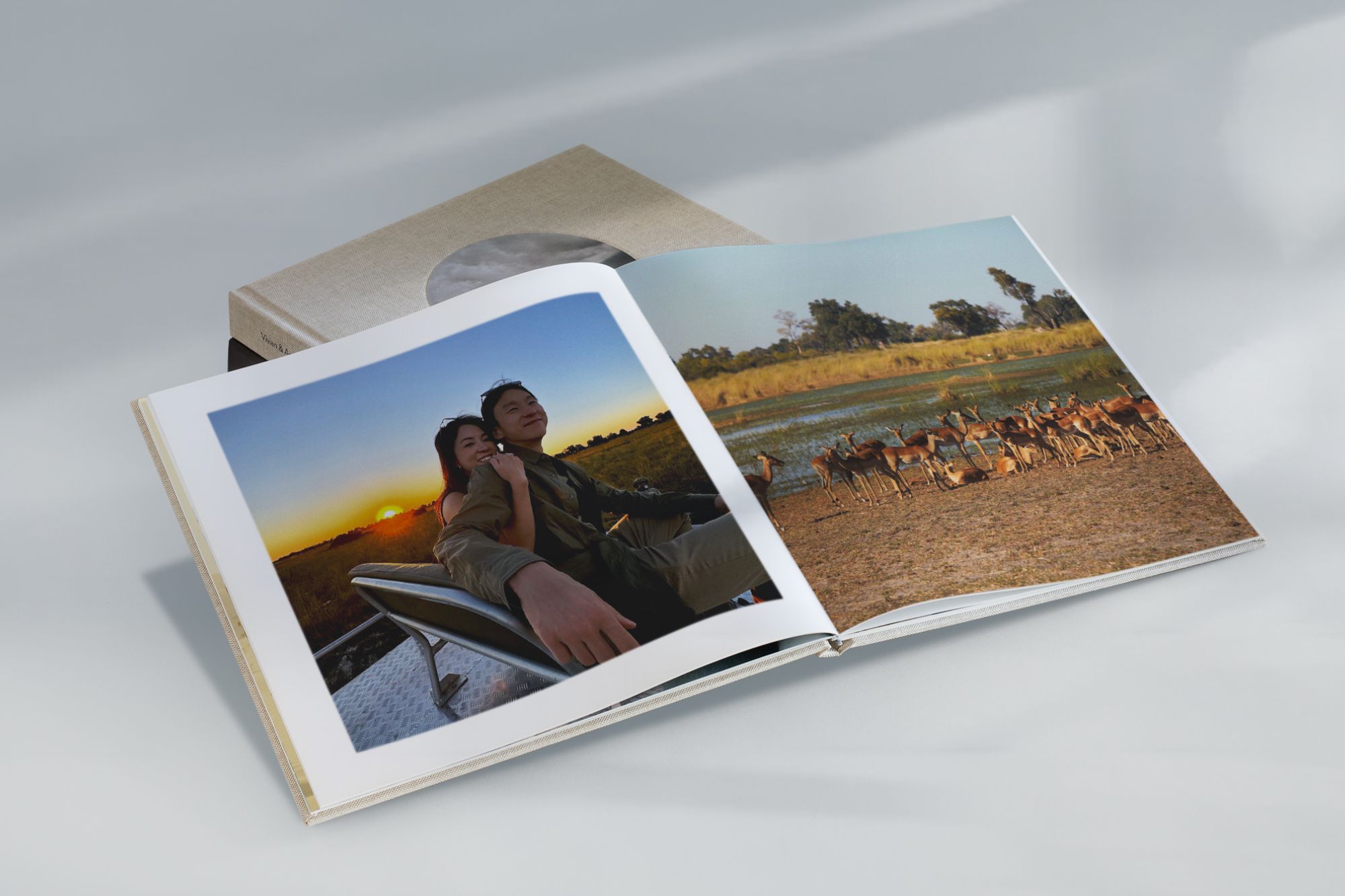 photo of custom photo book with couple on Safari