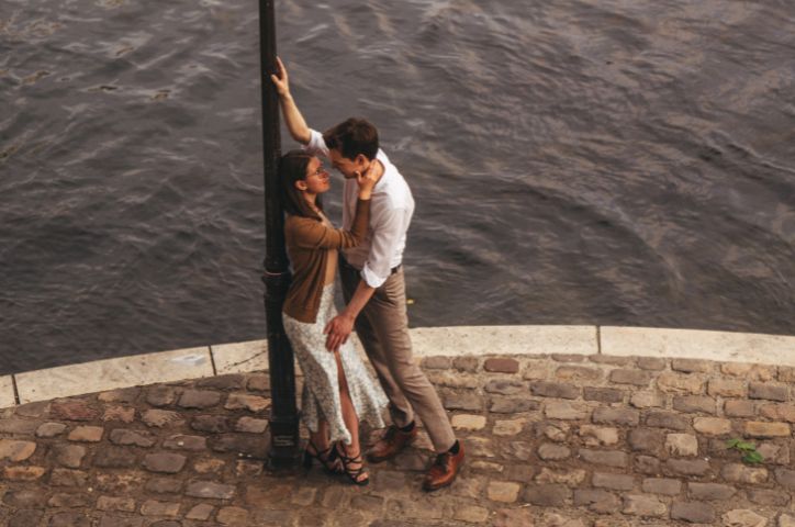 Couple on a honeymoon standing on a pole