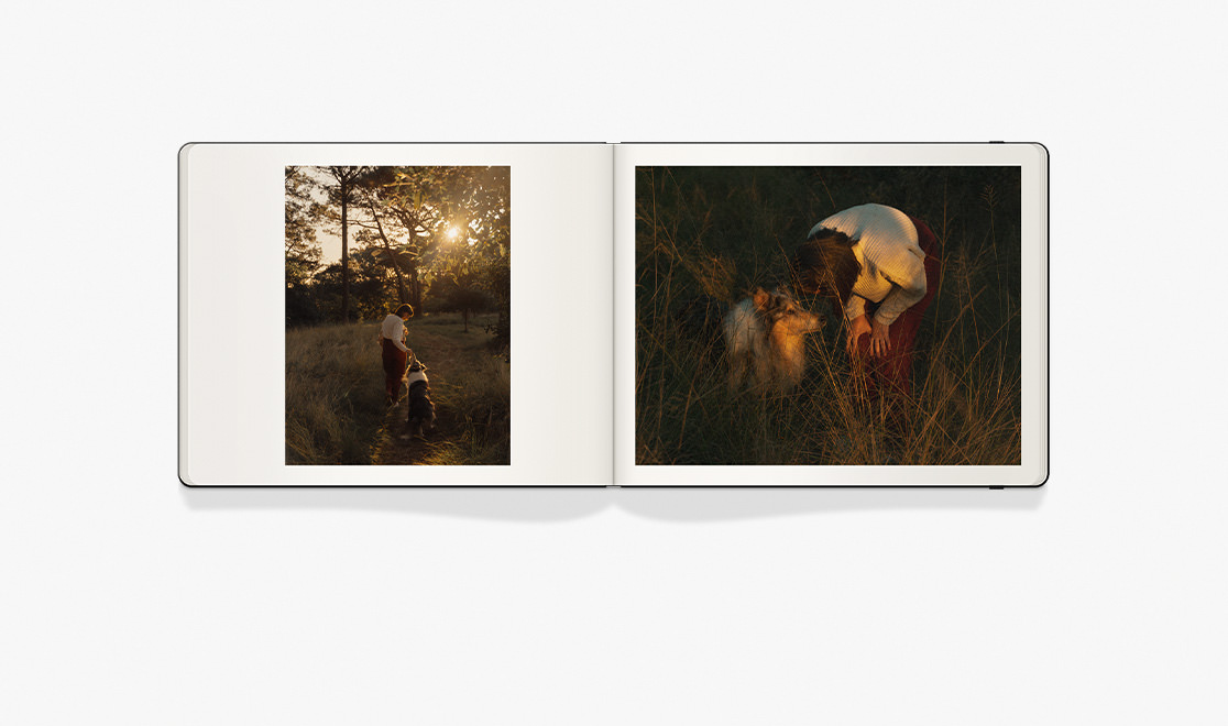 Open Square Moleskine Photo Book of a woman and her dog running through a field at sunset.