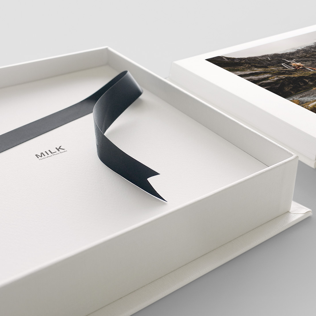 Presentation Box with black ribbon tailored for a Premium Photo Book.