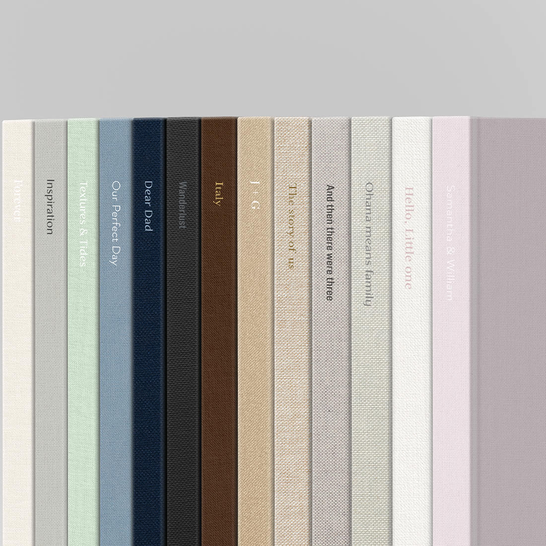 Line up of several Premium Photo Book fabric cover options.