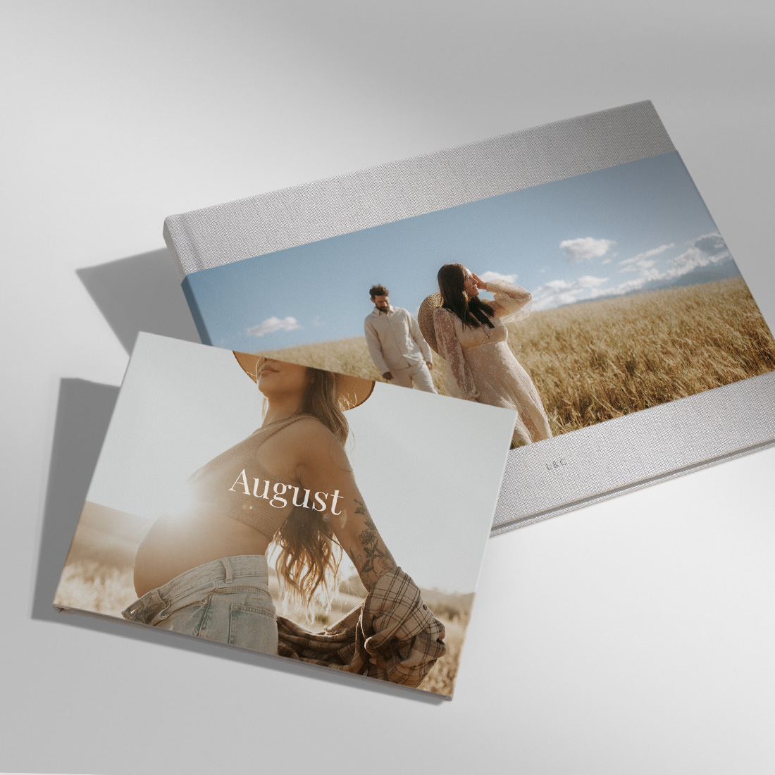 Large and Medium sized Landscape Premium Photo Books lay together with partial jackets covered in high quality imagery.