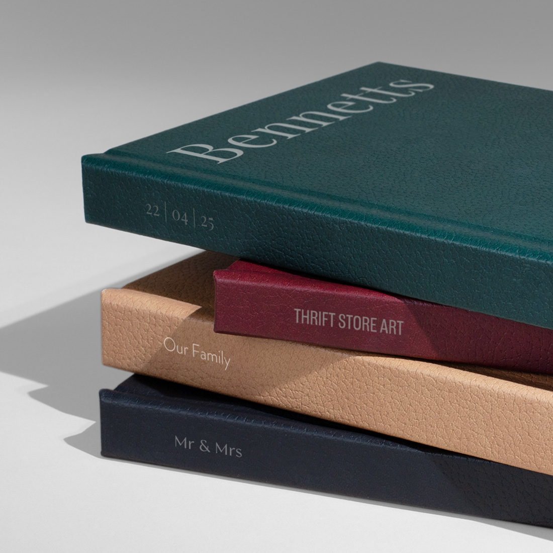Four Vegan Leather cover options displayed in a stack.