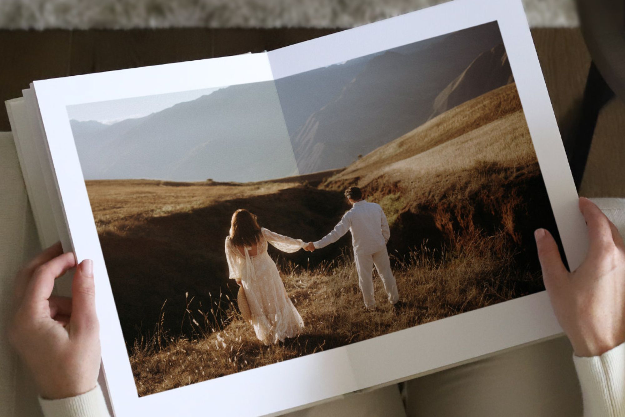 Book open to image of girl and boy holding hands