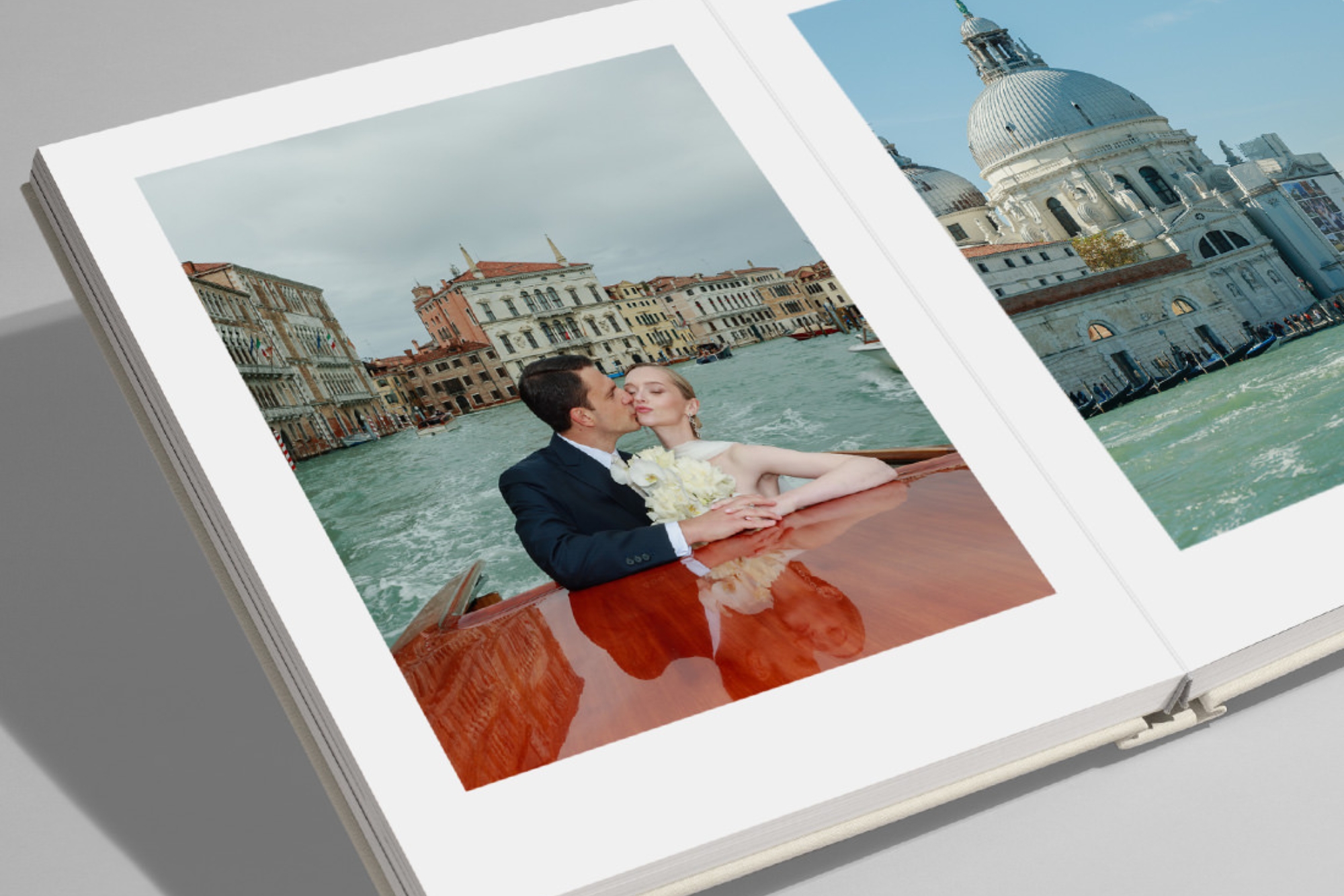 Open MILK Square Leather Photo Album with wedding photos inside double-page spread.