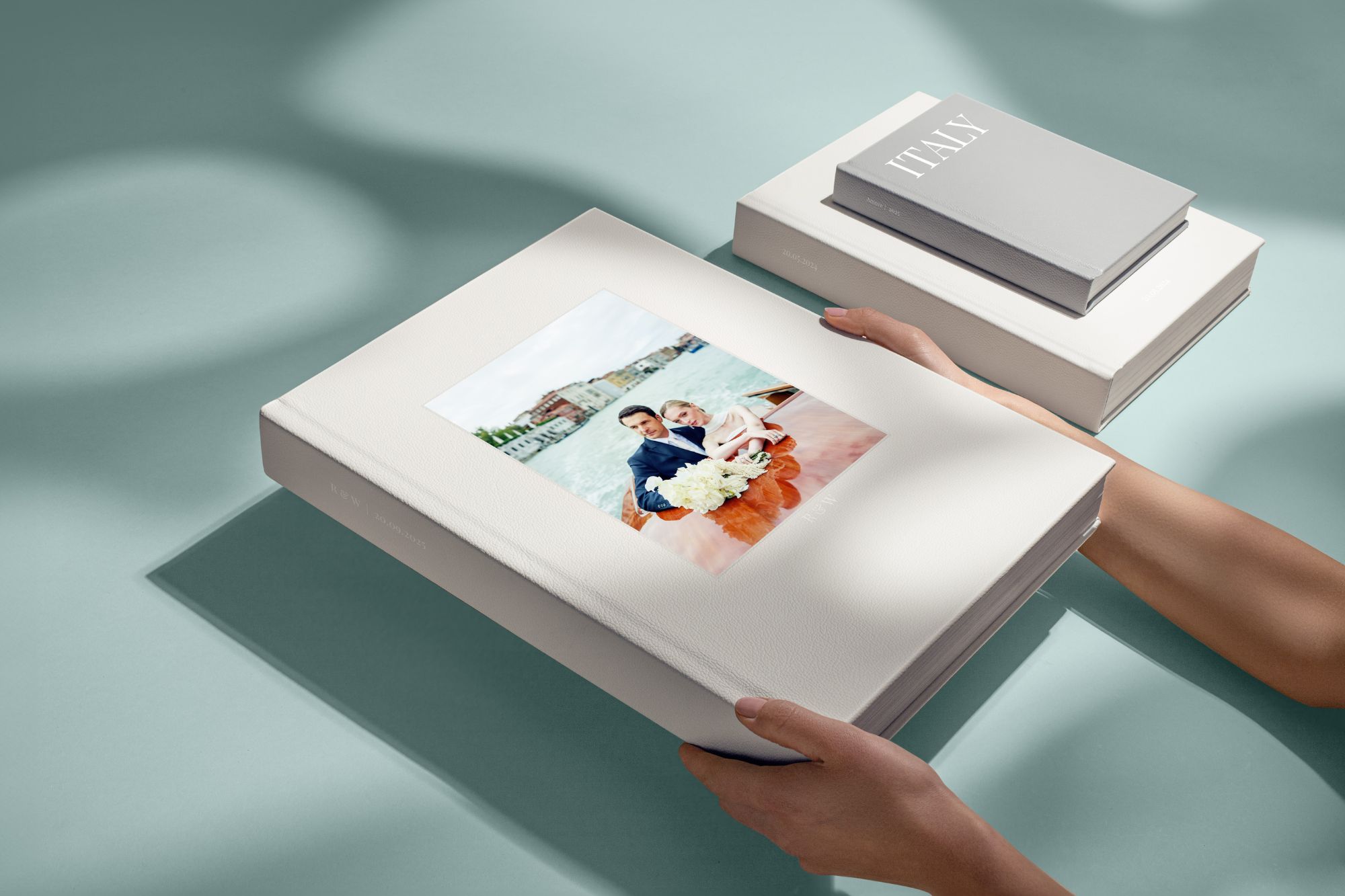 hands holding an extra large wedding album