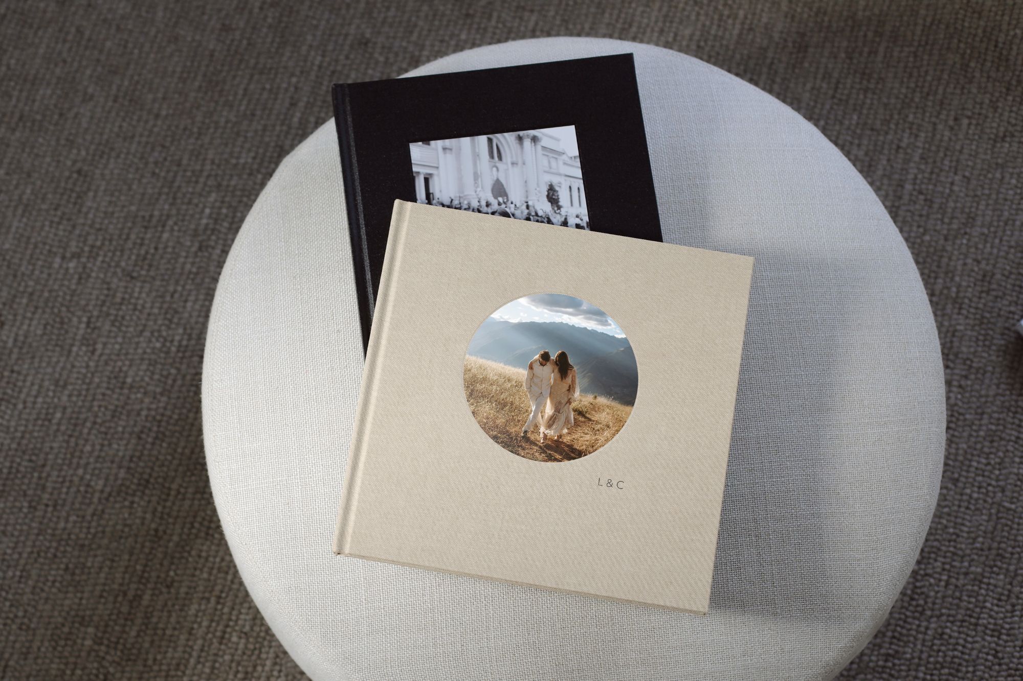 a linen custom photo album on a fabric stool