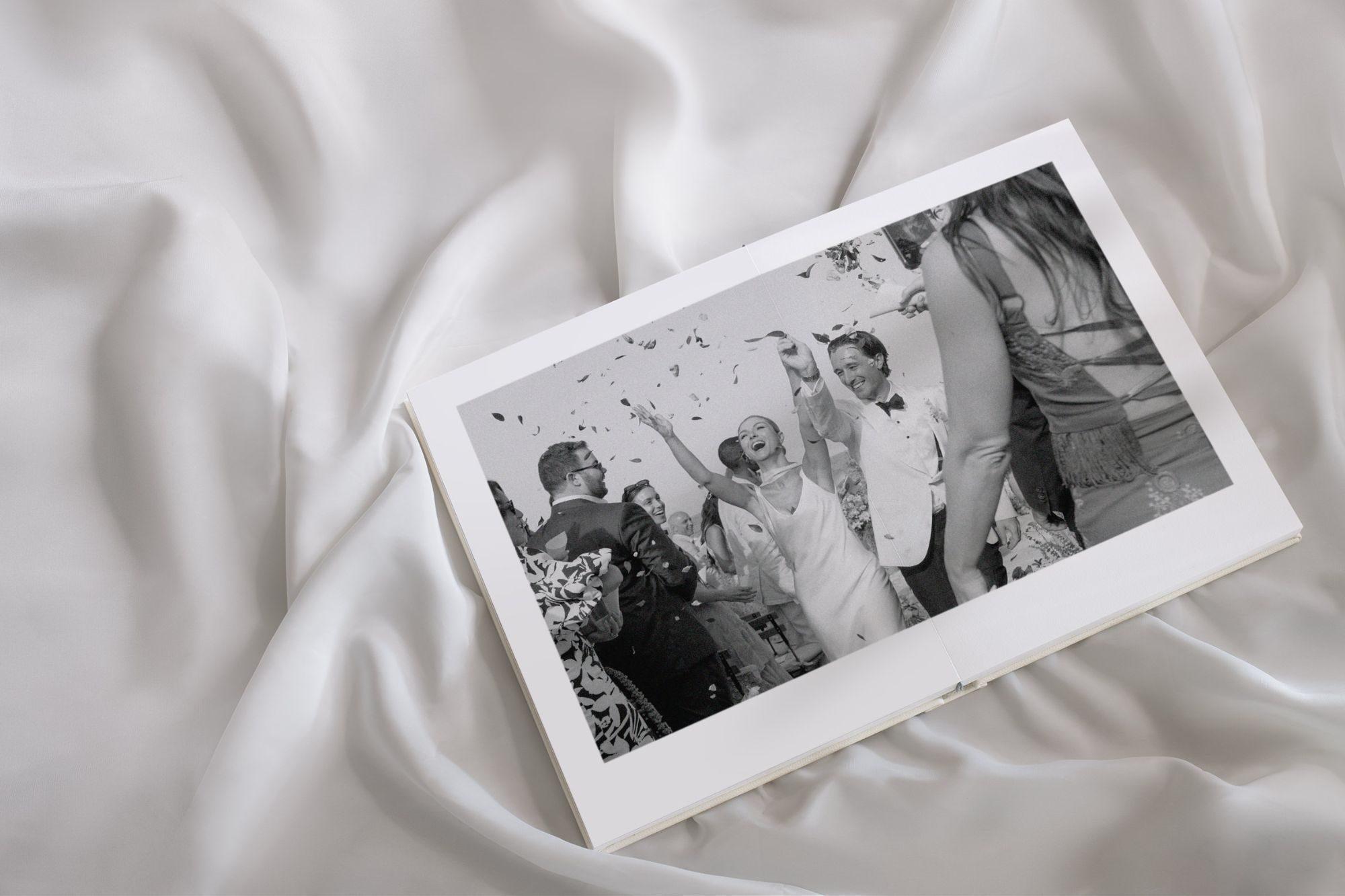 Women and man holding hands celebrating