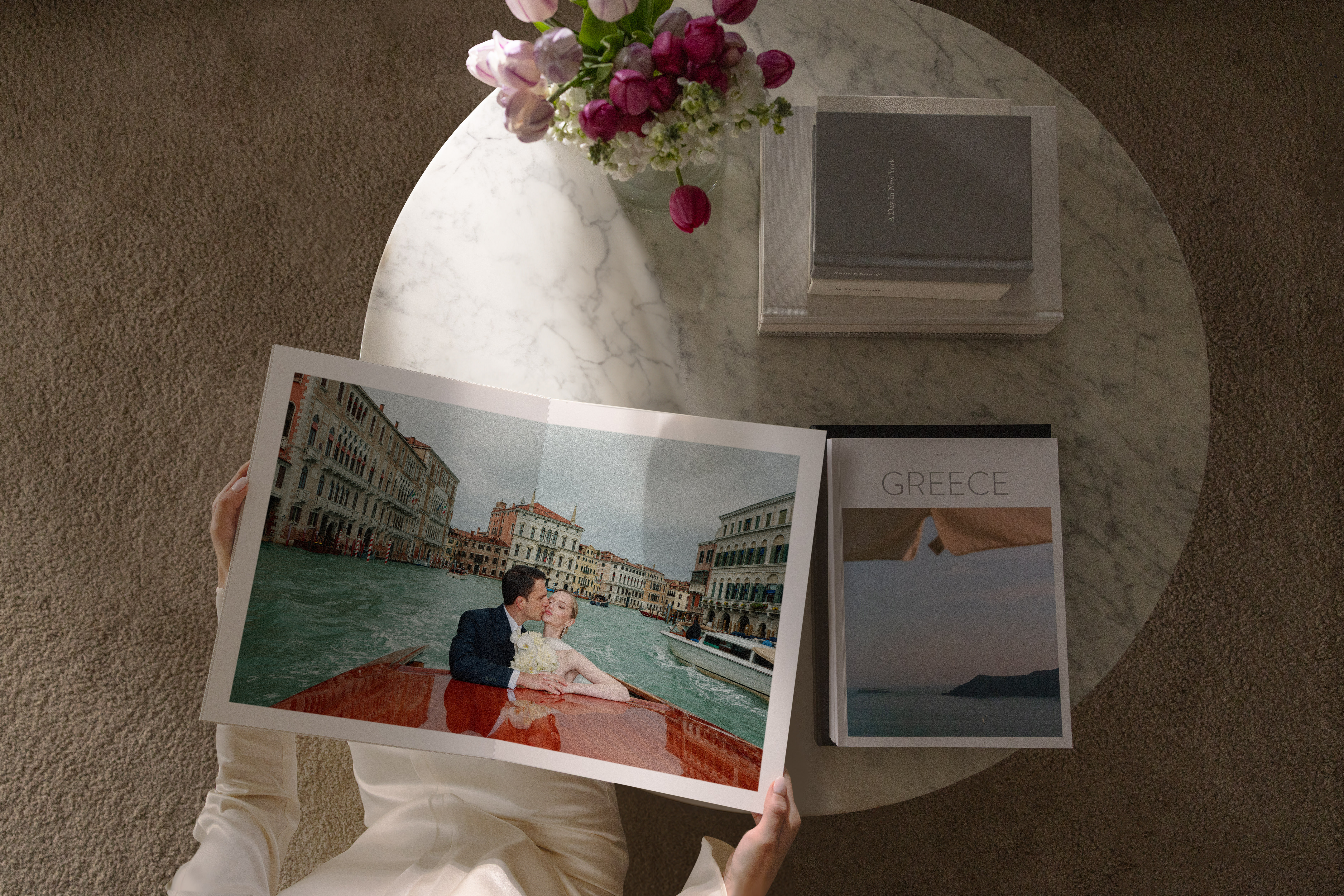 overhead shot of a wedding photo book with bride and groom on boat