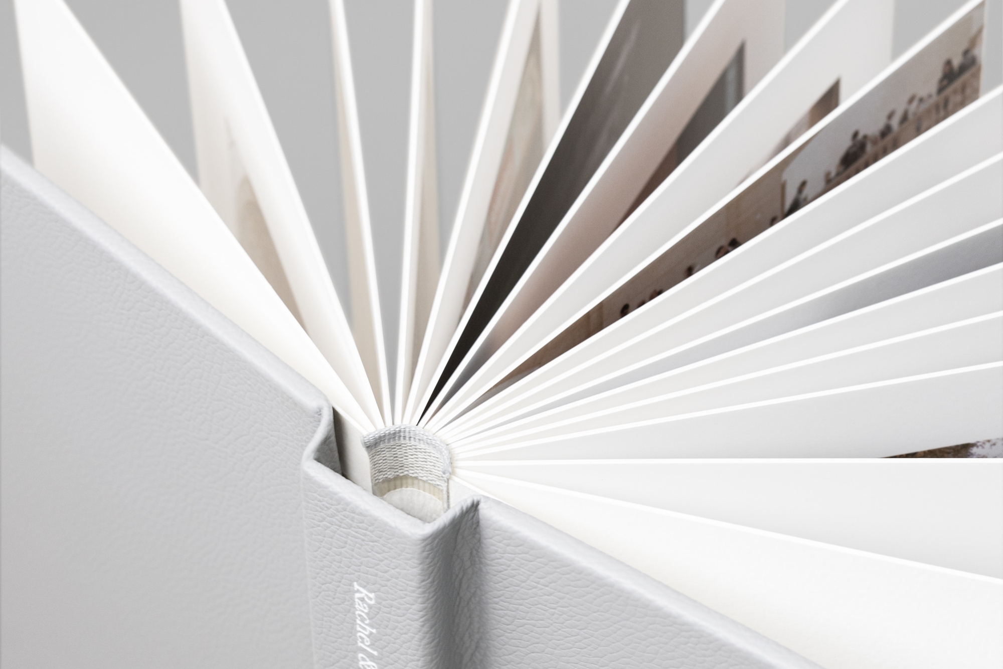 Close up of pages spread out to see thickness in detail inside a Leather Photo Album.