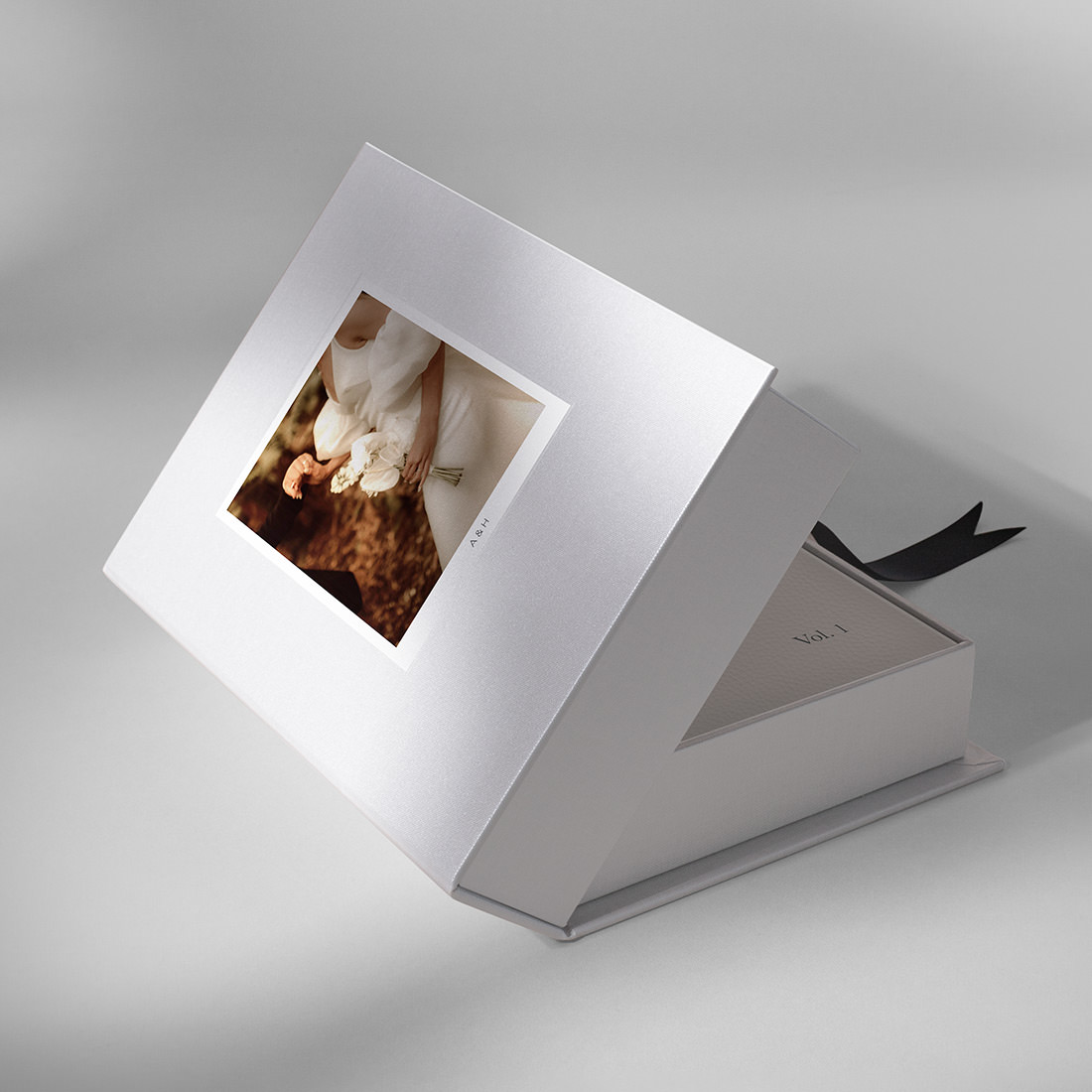 Open Leather Photo Album Presentation Box with wedding photo on cover.