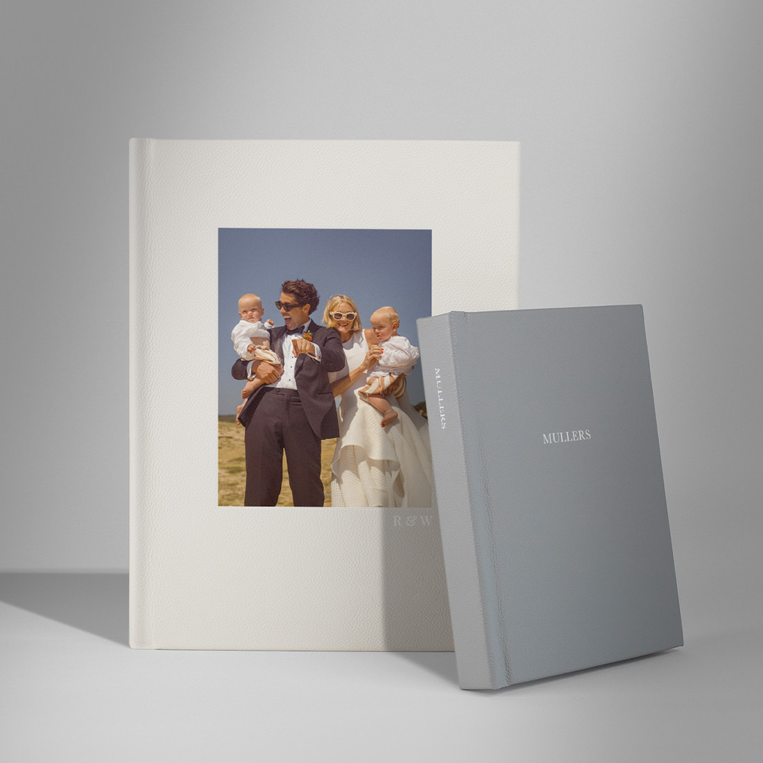 Portrait Leather Photo Albums in different sizes standing together.