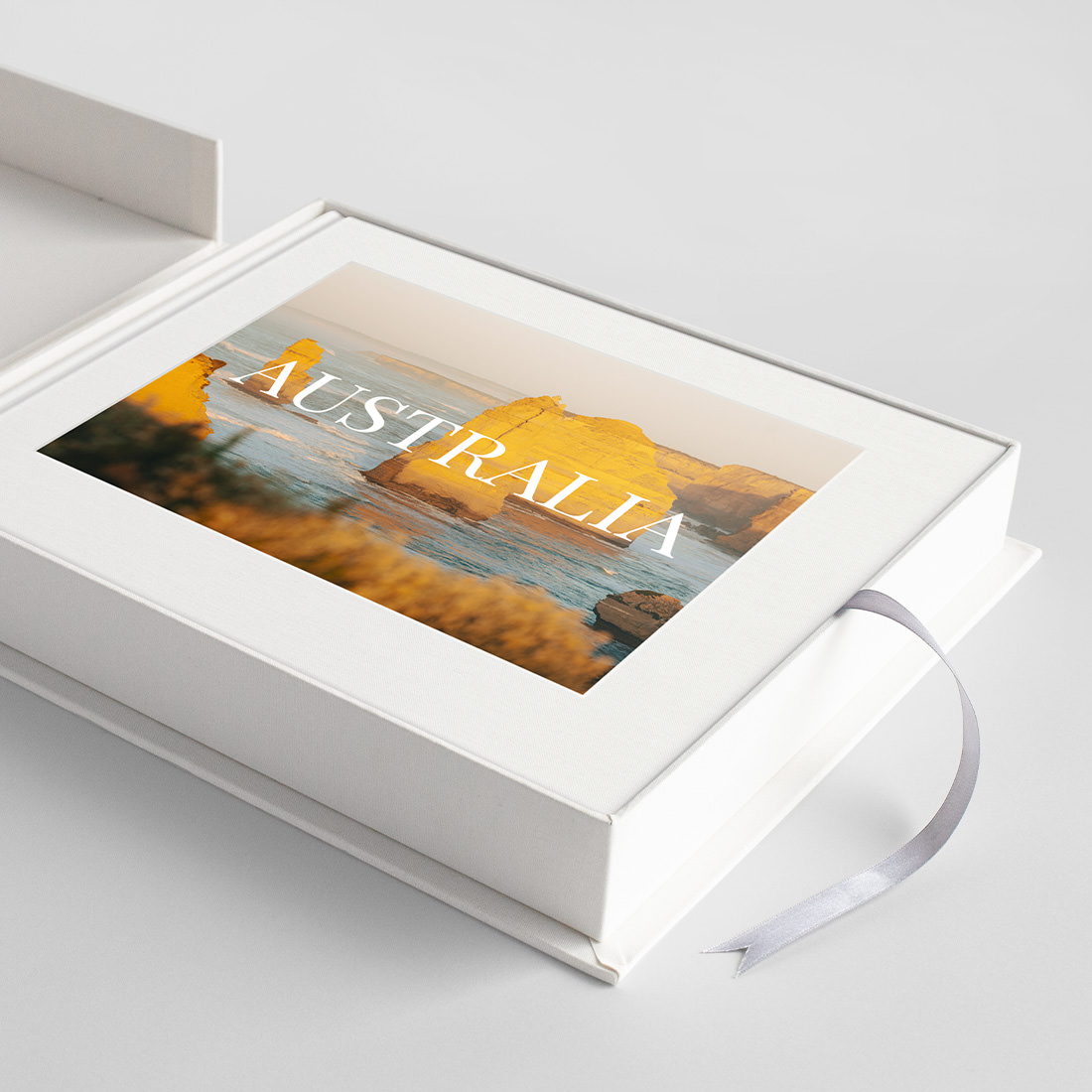 Close up of open Classic Presentation Box with silver pull out ribbon.