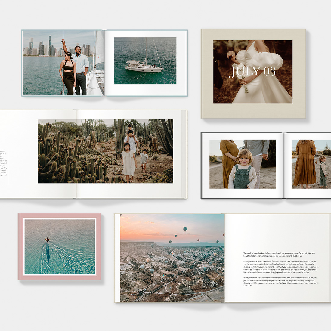 Selection of Classic Photo Albums showing designer photo templates while laid flat on table.