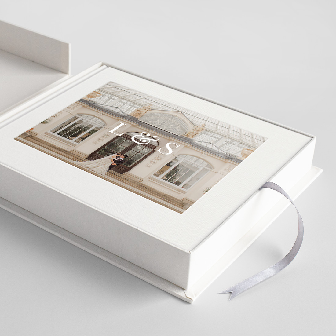 Open Classic Album inside Presentation box with silver pull out ribbon.