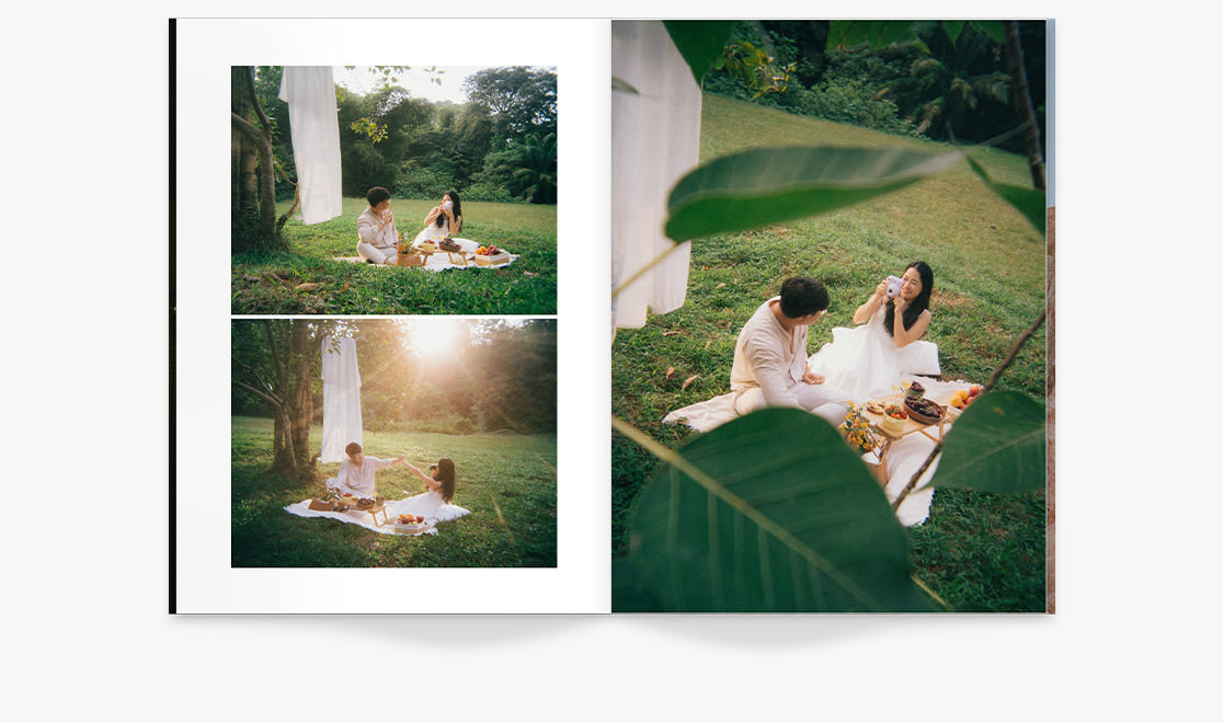 Open Wedding Magazine with couple sharing a picnic in photos on double-page spread.