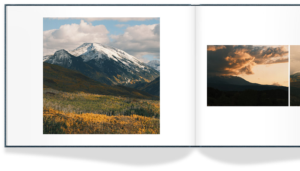 A photo book featuring several photos of mountains in Colorado with yellow flowers and lush green hills.