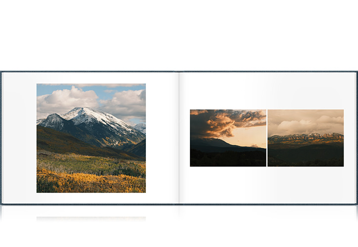 An open Premium Landscape Photo Album featuring several photos of mountains in Colorado with yellow flowers and lush green hills.