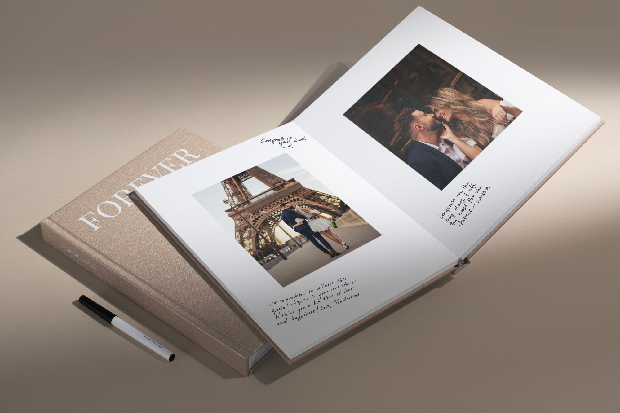 Open guest book with signatures and champagne cover fabric