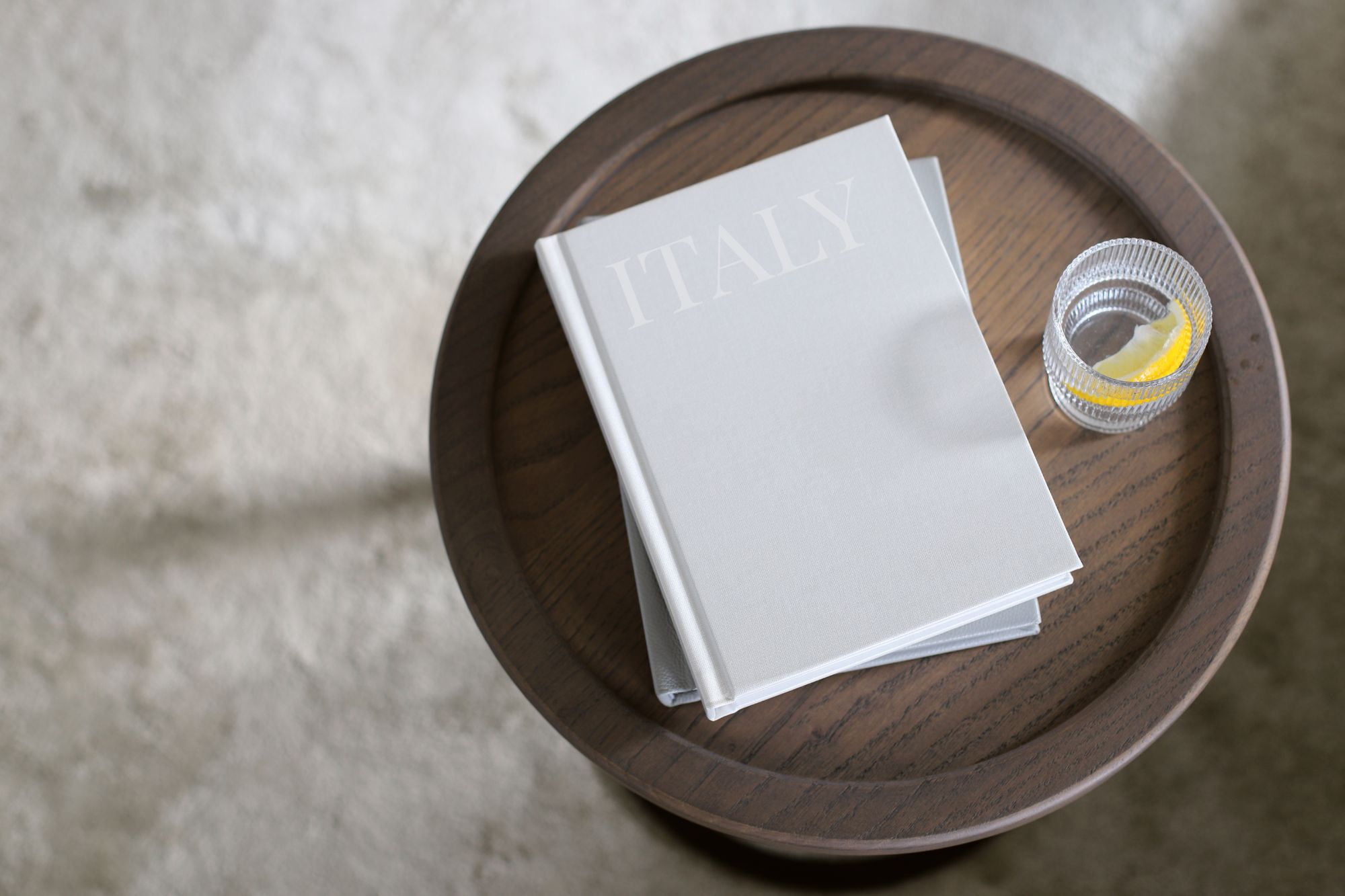 Photo book titled Italy on coffee table