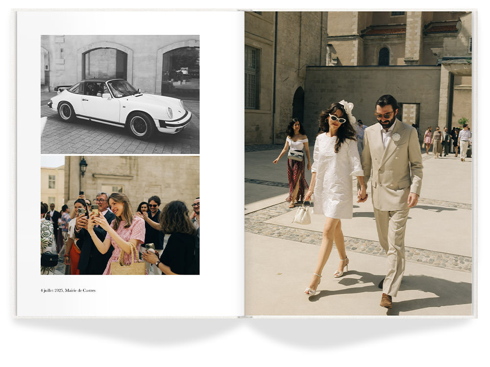 Open Premium Photo Book with newlywed couple walking hand in hand across courtyard.