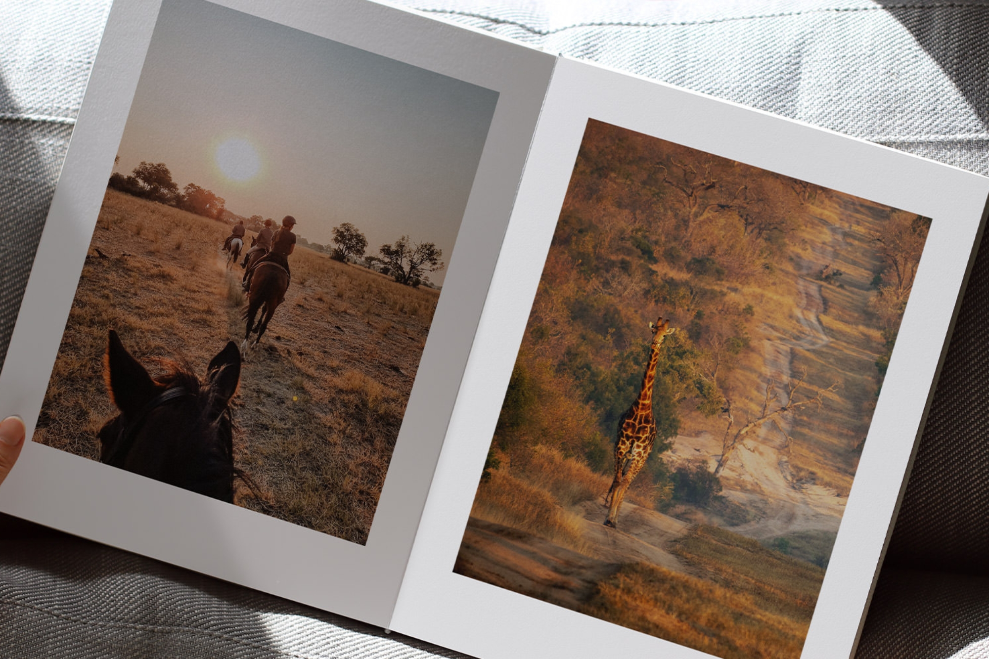 Open Portrait Premium Photo Album with photos of a safari trip inside pages.
