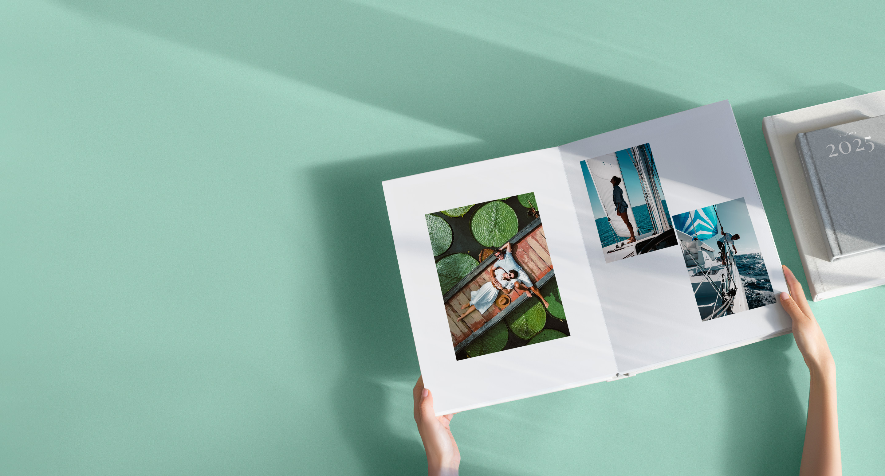 Black gift box wrapped with a velvet black ribbon on shadowy black background.