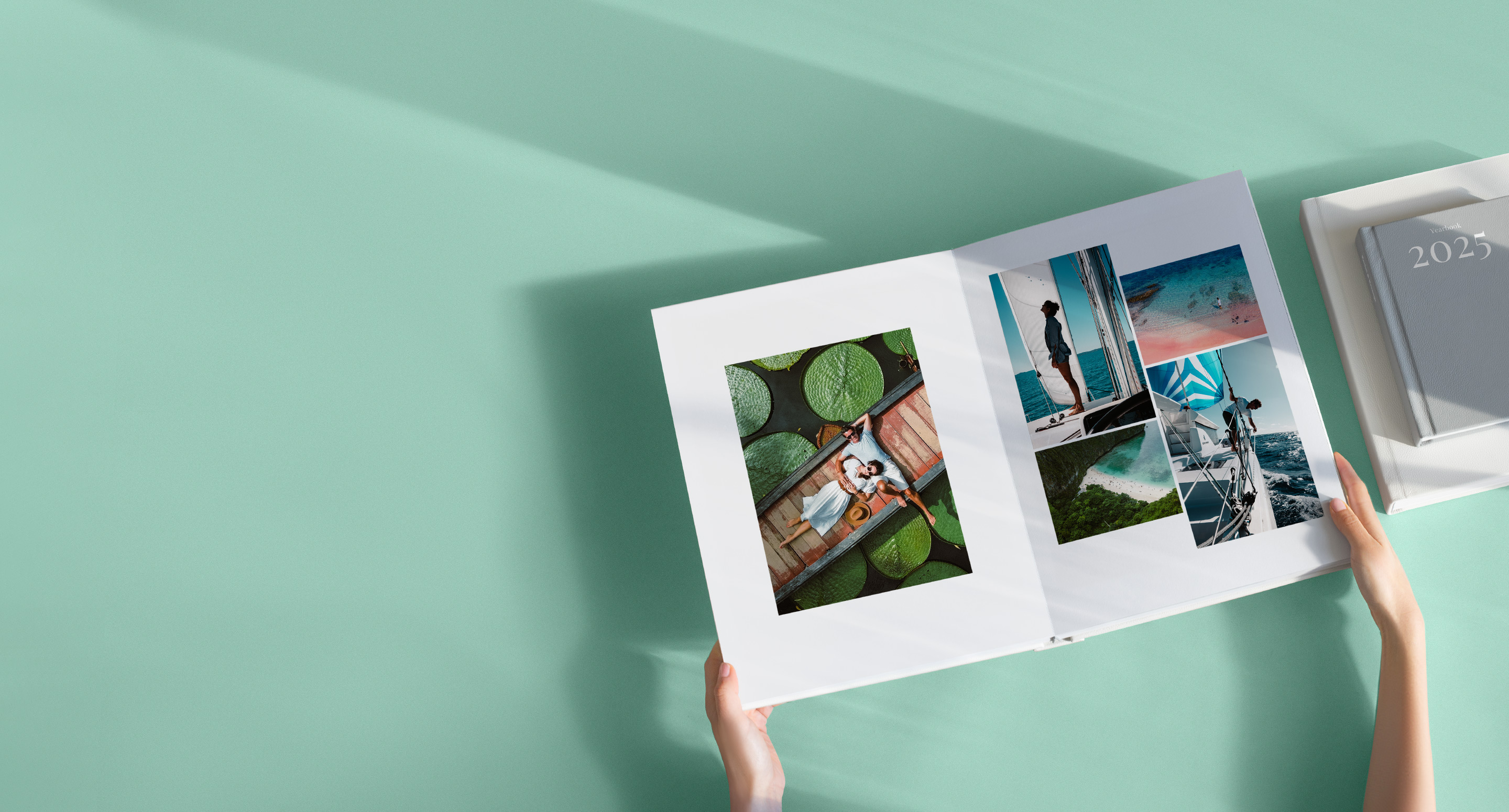 Black gift box wrapped with a velvet black ribbon on shadowy black background.