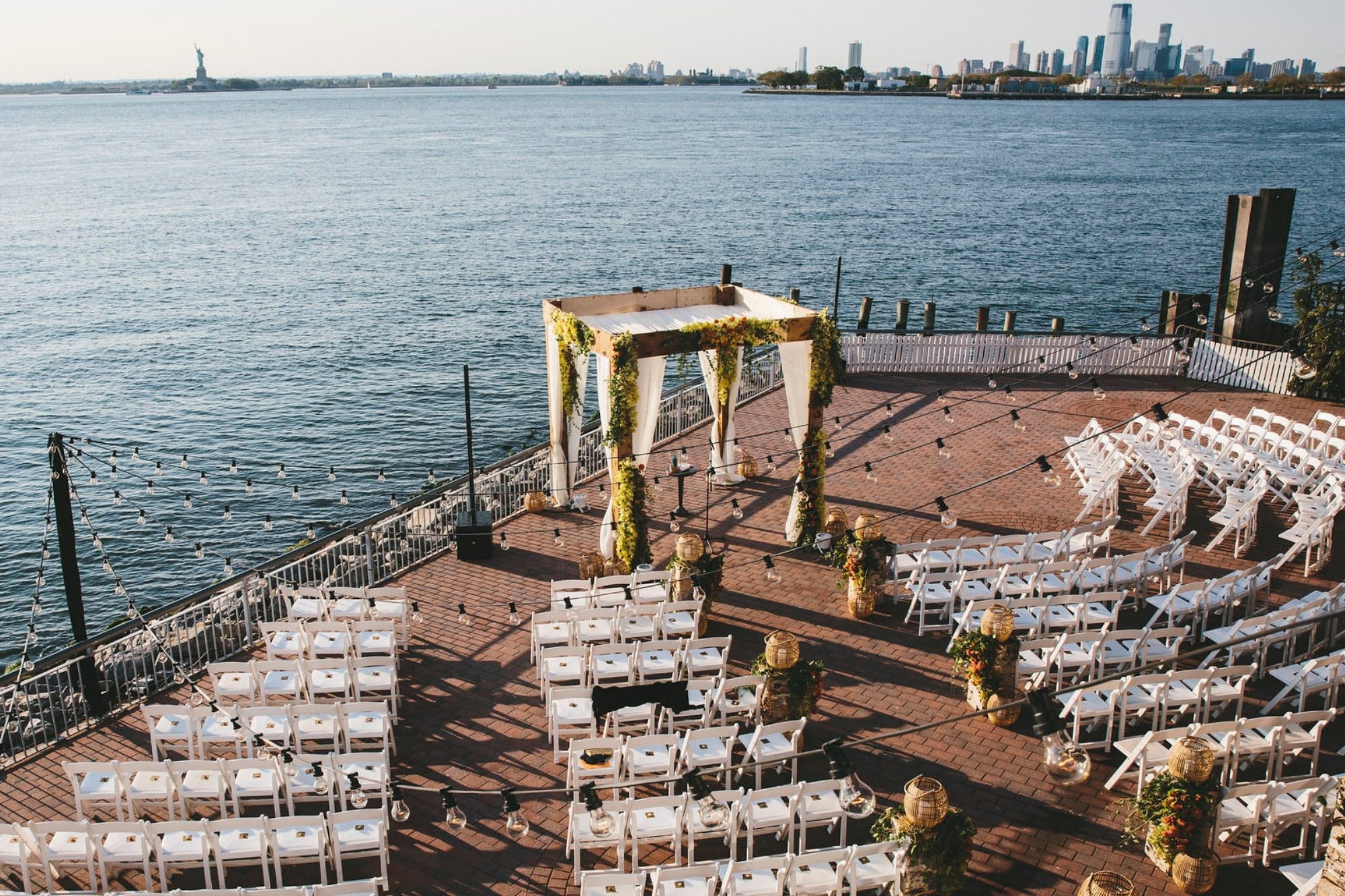 Top down view of pier at Liberty Warehouse set up for wedding ceremony overlooking the harbour.