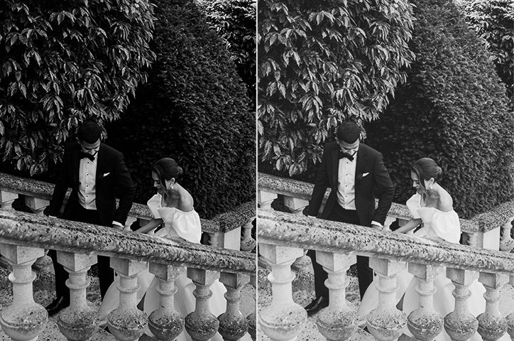 Black and white photo of newlyweds going up outdoor castle steps together.