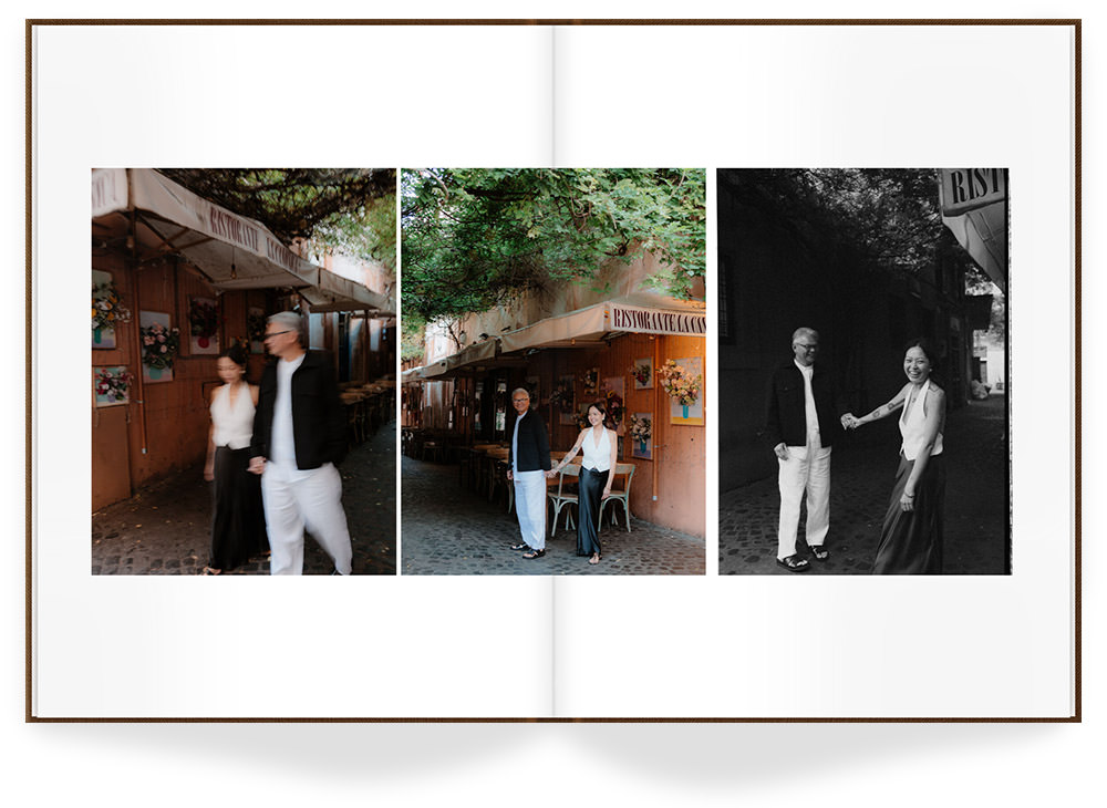 Open Premium Photo Book with photos of couple holding hands walking through cobblestone streets.