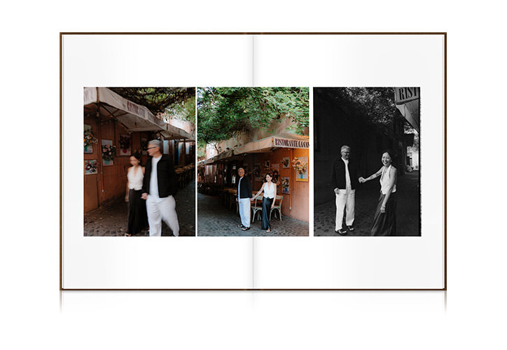 Open Premium Photo Book with photos of couple holding hands walking through cobblestone streets.