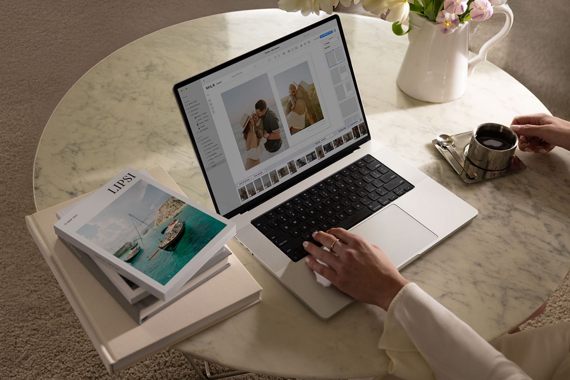 photograph of a woman on a laptop designing book