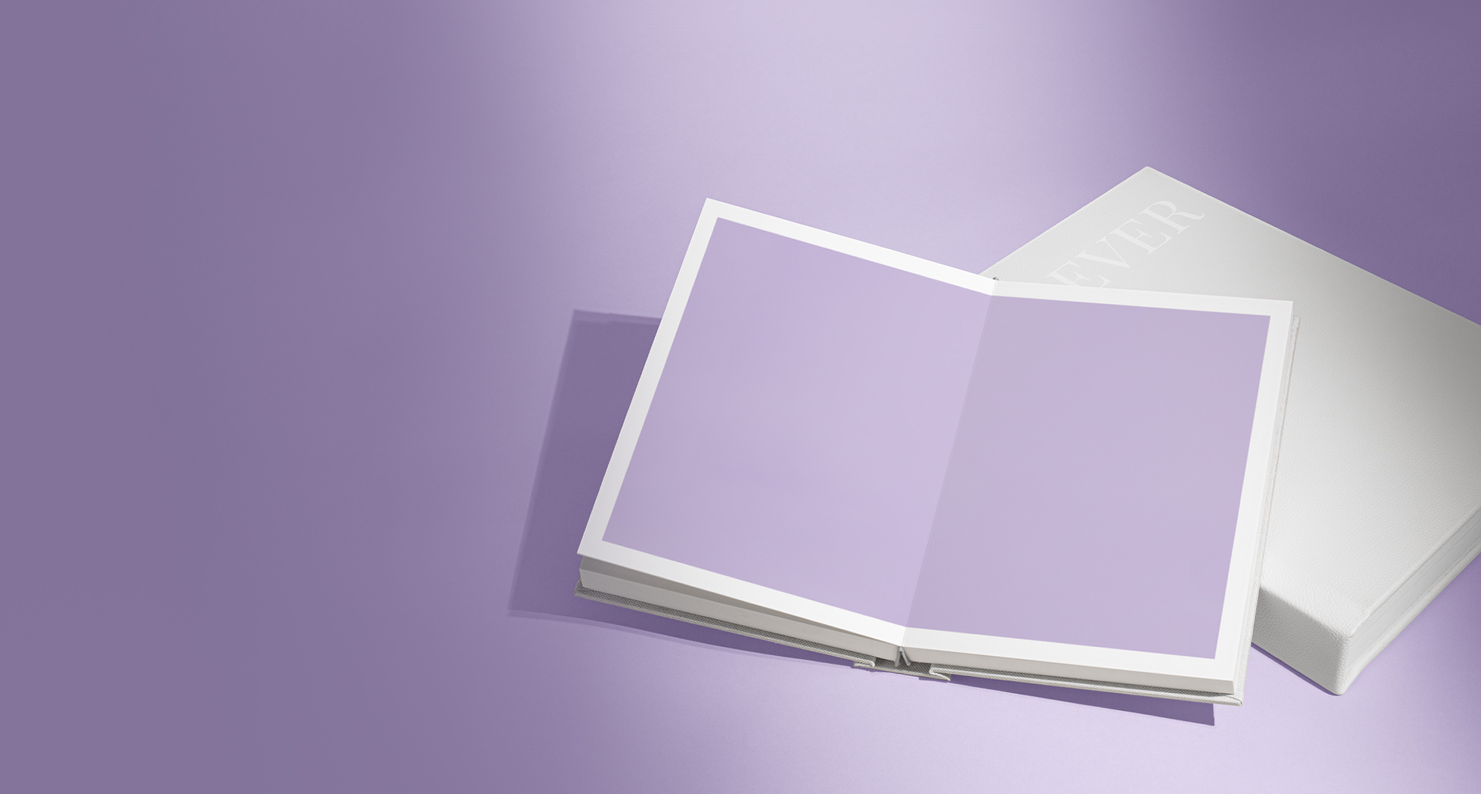 White Portrait Premium Photo Album open to show a rabbit on a purple background.