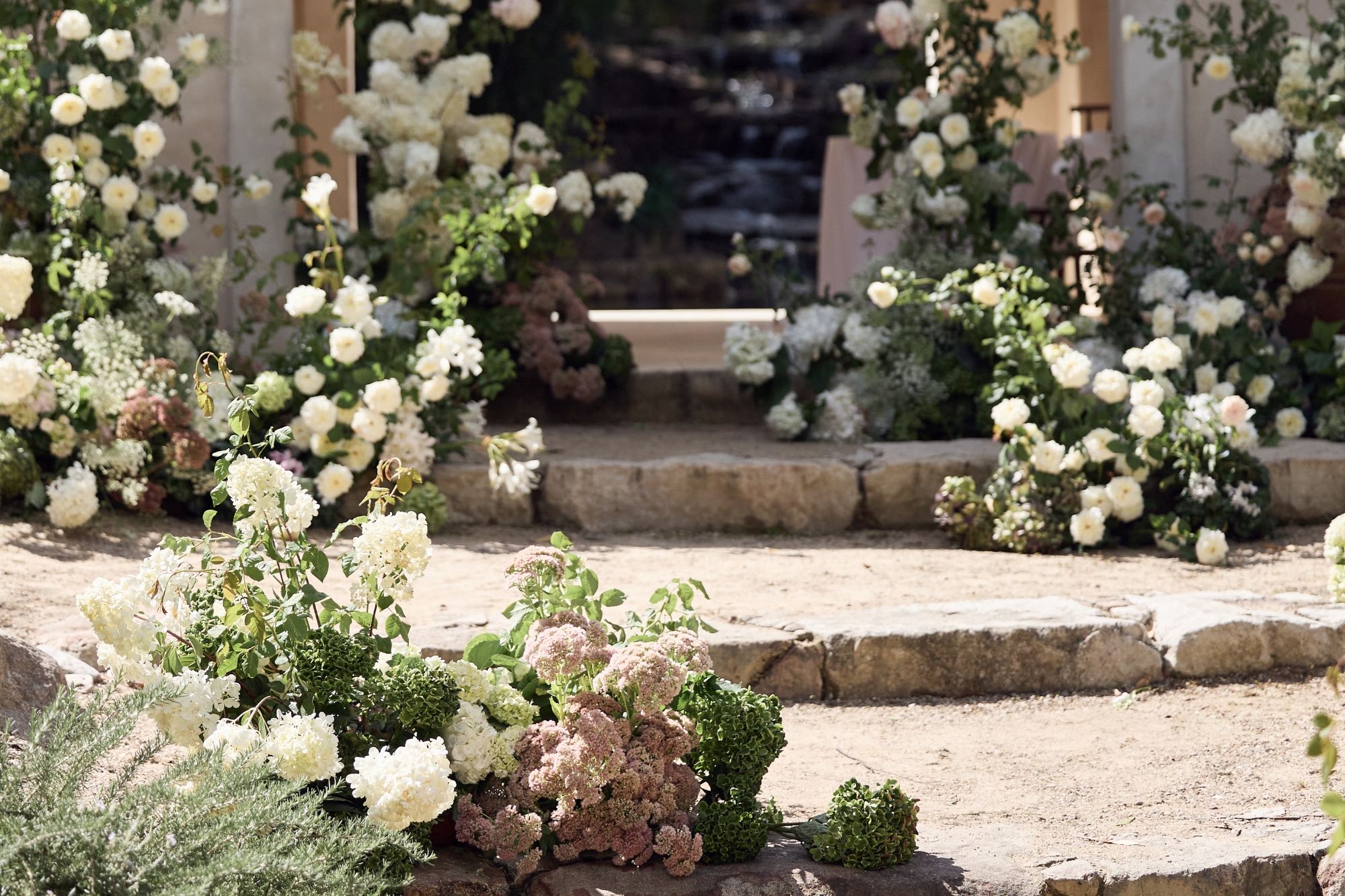 floral arrangement on stone stairs