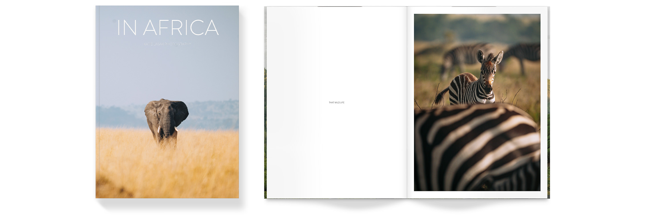 Open Travel Magazine with photos of African savannah featuring elephants and zebras inside pages.