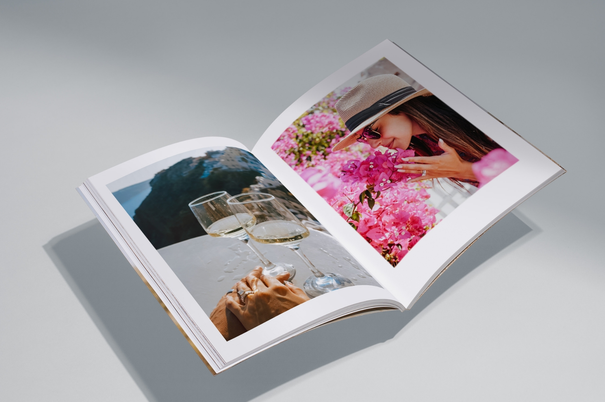 Open travel magazine on grey background.